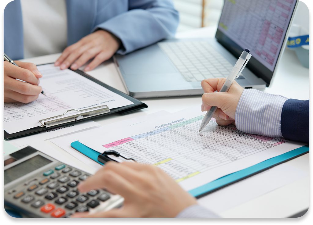 People working with documents and calculator.